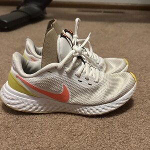 Nike White and Pink Sneakers with Yellow Accents